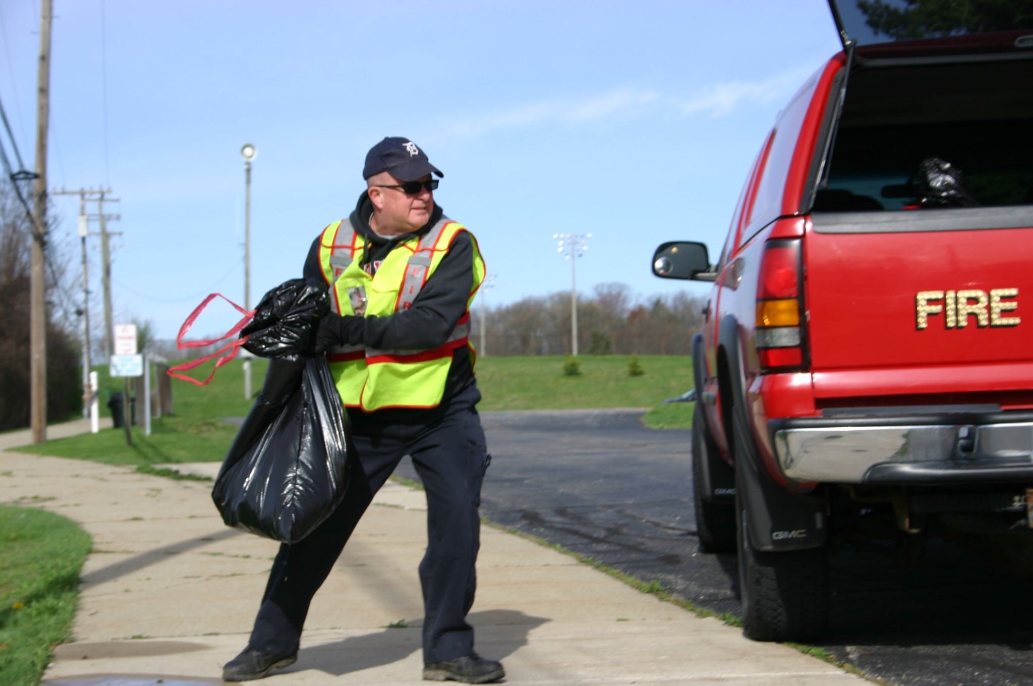 Chief Lyman collecting trash