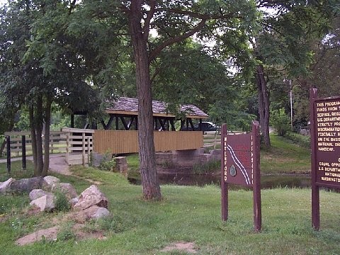 A covered bridge on a canoe site